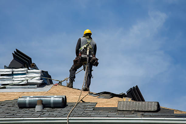 Professional Gutter Installation technician working in Middle Village, NY